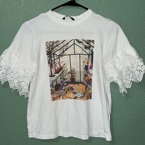Blouse with textured sleeves with greenhouse scenic print